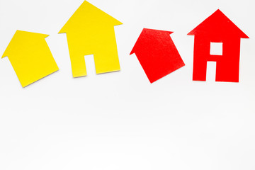 work desk with paper figures for selling house set white background top view space for text