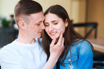 Man and woman dating in cafe . Happy couple drinking coffee in outdoors cafe on summer vacation