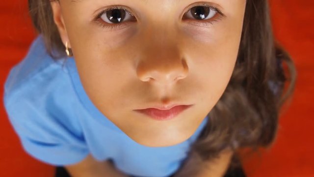 Sad face of a child close-up. Face of a little girl close-up.
