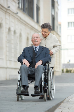 elderly couple going for a stroll