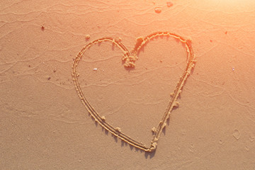 illustration of a heart drawn on sand