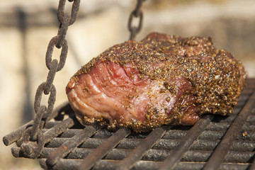 Grilled beef steak on wood plate