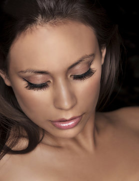 Beautiful womans face eye makeup and lashes
