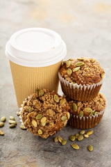Healthy pumpkin muffins with coffee to go