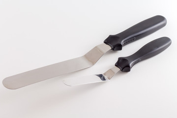 Spatula or Cake scraper for scraping fondant or icing on cake pastry of pie isolated on white background