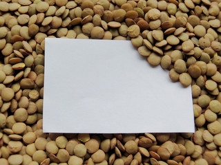 Closeup of White tag on raw lentils background