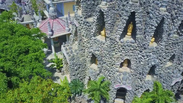 Flycam Shows God Statues in Buddhist Temple Tower Windows