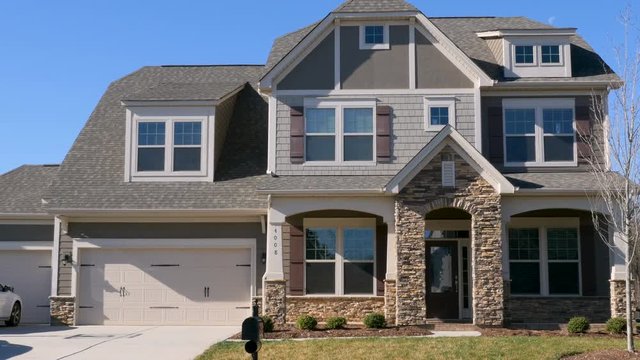 Push in establishing shot of a modern generic suburban middle class home