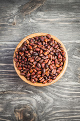 Pine nuts on wooden background.  Top view.