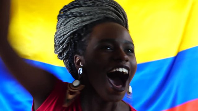 Colombian Young Black Woman Celebrating with Colombia Flag