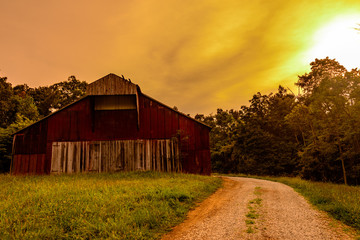 red barn sun set  © logan