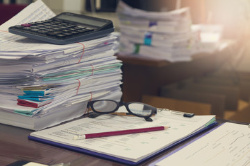 Business and finance concept of office working, Pile of unfinished documents on office desk, Stack...