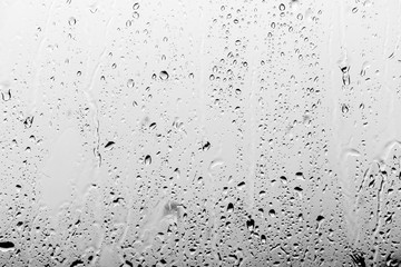 Naklejka premium Rain drops on the glass, background