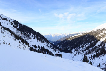 Fototapeta na wymiar Mountain panorama and trees with snow in winter in Stubai Alps, Austria