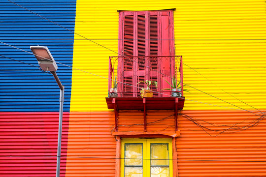 Colorful house in La Boca, Buenos Aires, with balcony and street light