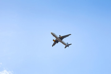 Fototapeta na wymiar Airplane in the blue sky