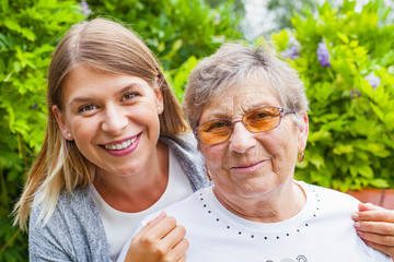 Senior lady with beautiful granddaughter