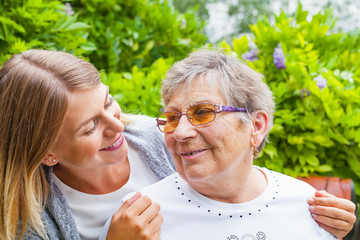 Senior lady with beautiful granddaughter