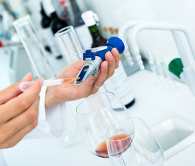 Wine being checked on component saturation in laboratory