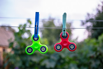 Fidget spinners on wire with clothespins