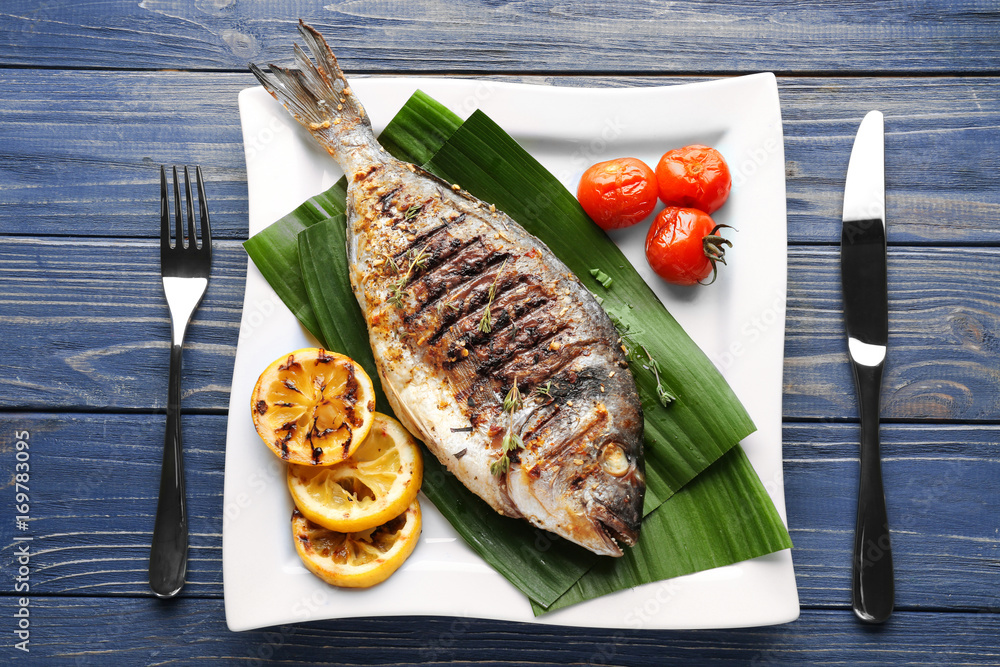 Canvas Prints plate with delicious fried fish on table