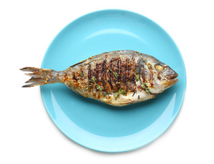 Blue plate with delicious fried fish on white background