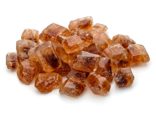 Brown caramelized lump cane sugar cube isolated on white background cutout