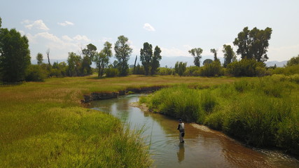 Aerial view of fly fisherman fishing in Montana river