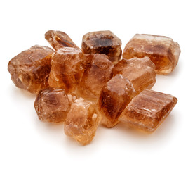 Brown caramelized lump cane sugar cube isolated on white background cutout