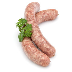 Raw sausage with parsley leaf isolated on white background