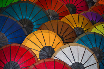 Colored paper Traditional umbrellas are sold in market. Laos