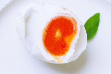 slide of salted  egg on white plate