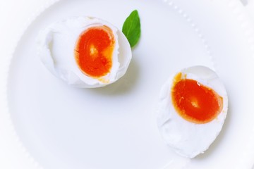 slide of salted  egg on white plate