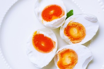 Salted egg on white plate