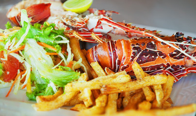 A dish with lobster and vegetables