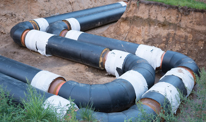 Laying of heating pipeline in the trench to provide new houses with hot water