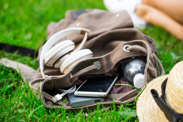 backpack with water, mobile phone and powerbank inside