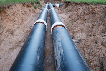 Laying of heating pipeline in the trench to provide new houses with hot water
