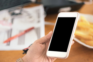 Close up of Asian women's hands holding cell telephone with blank copy space scree for your advertising text message or promotional content, Concept : working, meeting, study, education in coffee shop