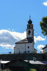 Fototapeta na wymiar Typical Houses and churches of the mountain village of Sauris