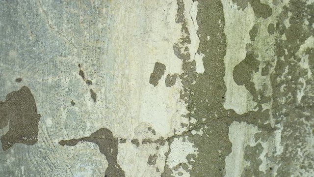Cracked wall, cracked concrete, building demolition. A crack in the concrete wall increases