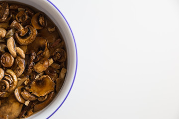 Close up over a bowl of mushrooms submerged in water