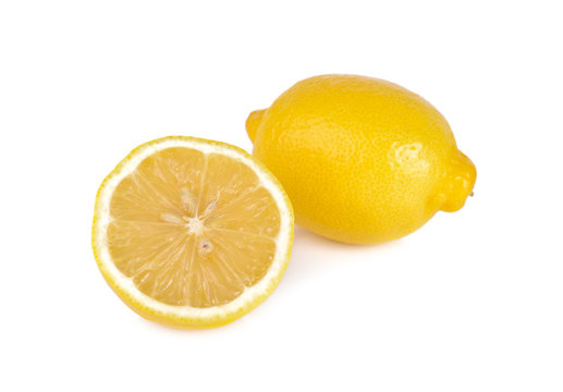 whole and half cut fresh lemon on white background