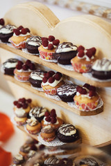 delicious colorful cookies and cakes on the wedding candy bar