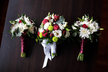 three beautiful wedding bouquets of delicate flowers
