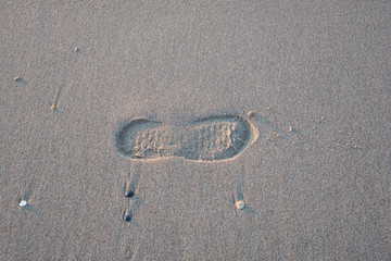 A footprint on the sand