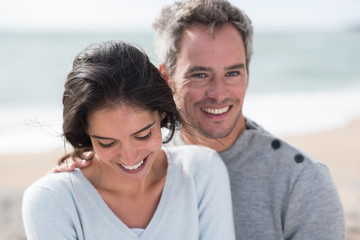Obraz premium Portrait of a middle-aged couple having fun on the beach