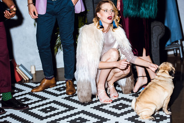 young woman with pug puppy