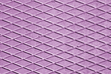 Violet color cement floor with rhombus pattern.