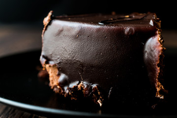 Devils Cake with Chocolate in black plate.